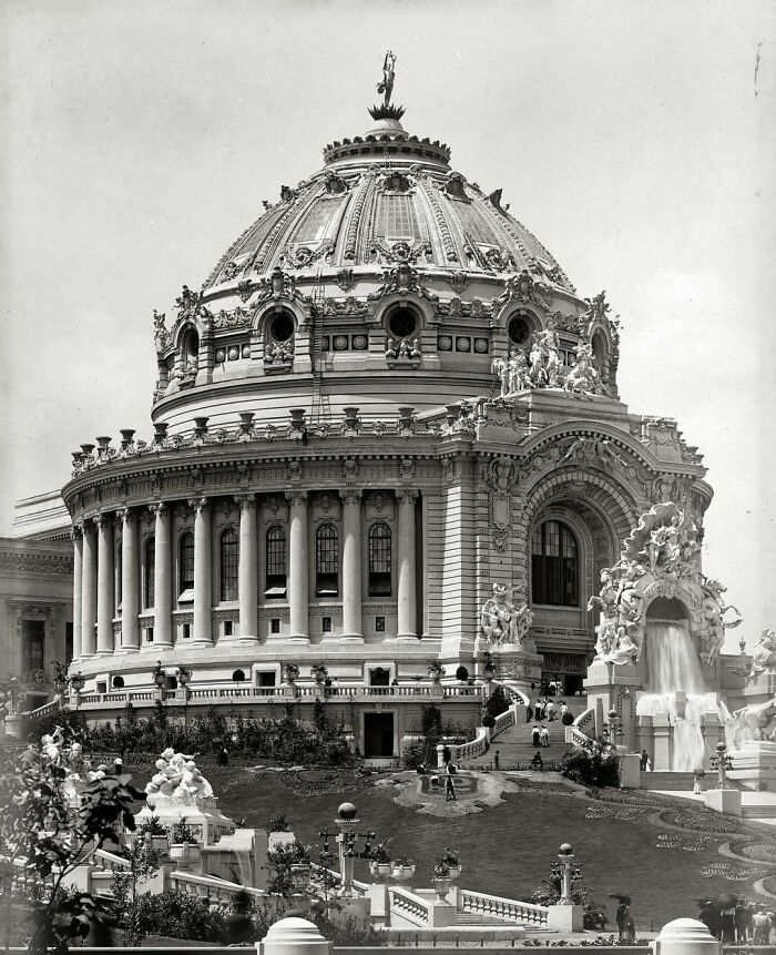 Historic American architecture featuring a grand domed building with ornate details and statues.