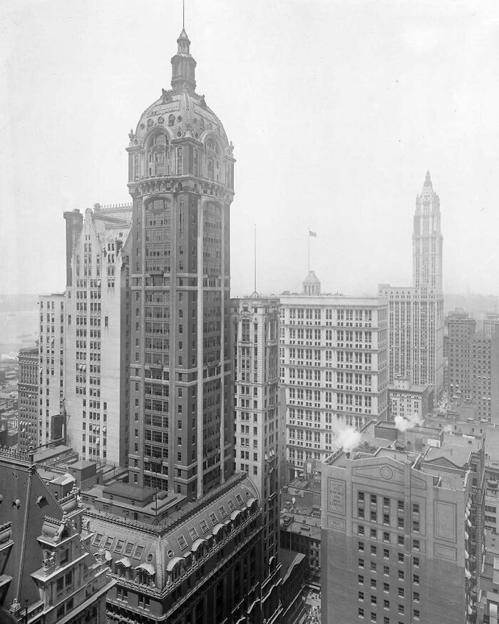 Historic skyscrapers showcasing old American architecture in a bustling cityscape.