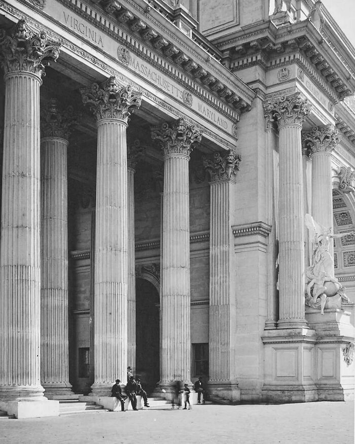 Old American architecture with grand columns and intricate stone carvings, exuding historical elegance and grandeur.