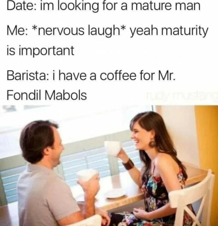 Couple enjoying coffee and laughing at a humorous meme about maturity during a date in a cafe.