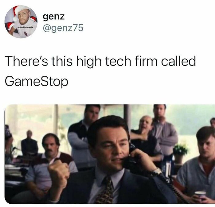 Man in suit on phone like a CEO, with text humorously calling GameStop a high-tech firm, creating work-related humor.