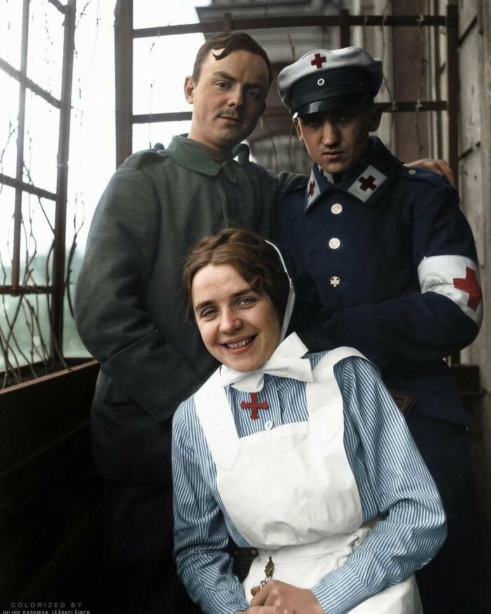 Three historical figures in uniform, including a smiling nurse, representing the past with vintage medical attire.