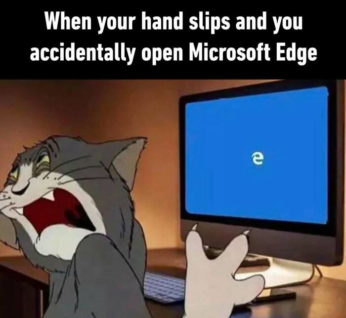 Cartoon cat humorously shocked after accidentally opening Microsoft Edge, illustrating work-related humor.