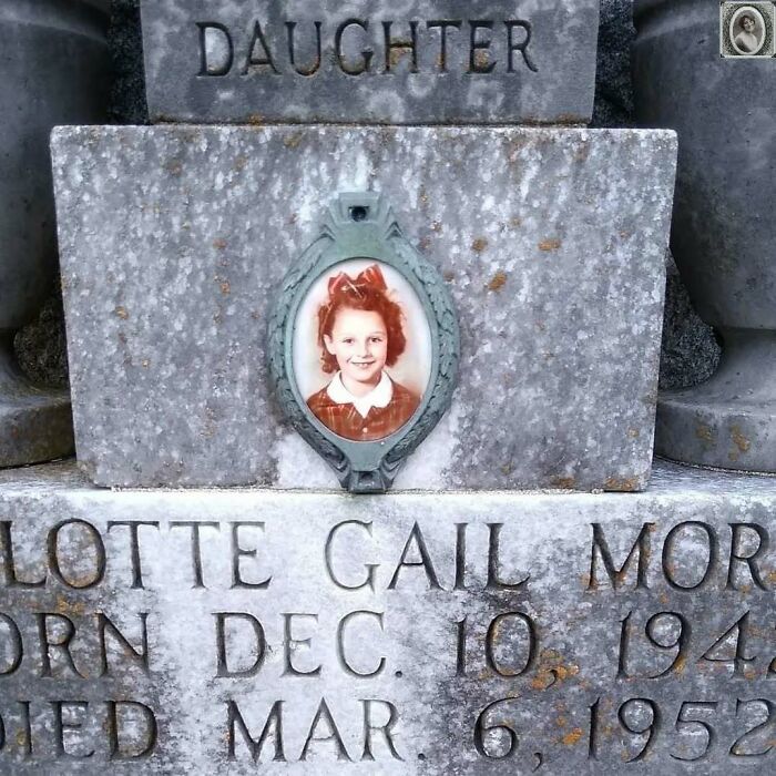 Young girl's headstone portrait set in weathered grey stone.