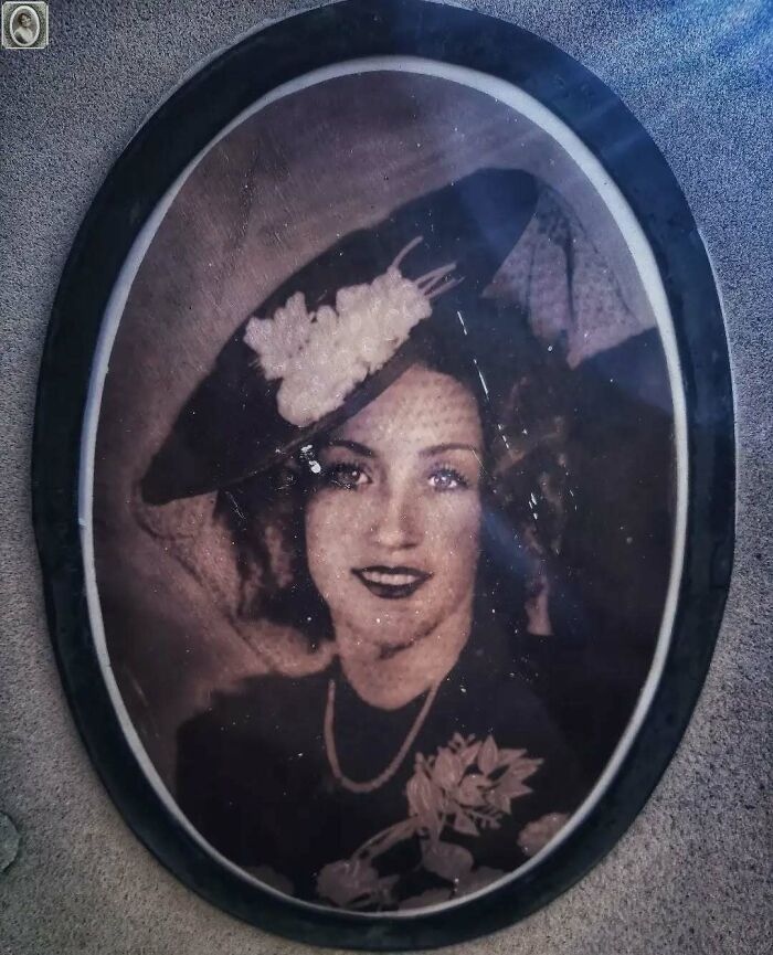 Portrait of a woman in a vintage hat and floral dress on a headstone, showcasing lovely headstone portraits.