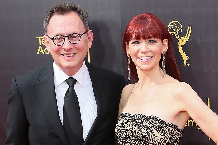 Carrie Preston and Michael Emerson posing together at a red carpet event, dressed in formal attire, smiling for the cameras.
