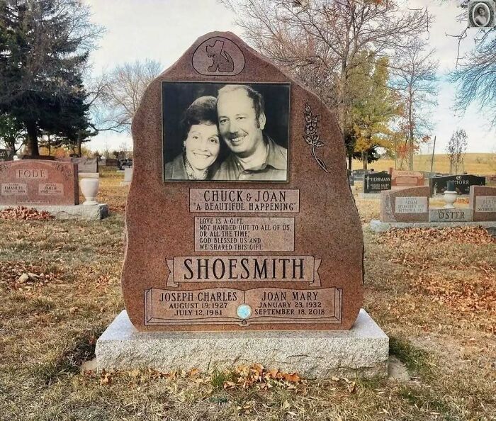 Headstone portrait featuring Chuck and Joan, with engraved tribute in a serene cemetery setting.