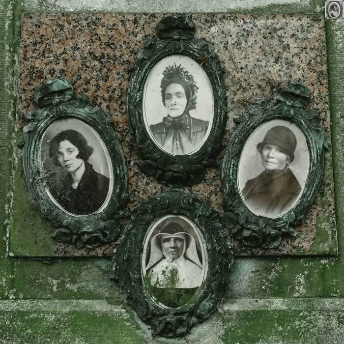 Four headstone portraits in ornate frames, weathered and vintage in appearance.