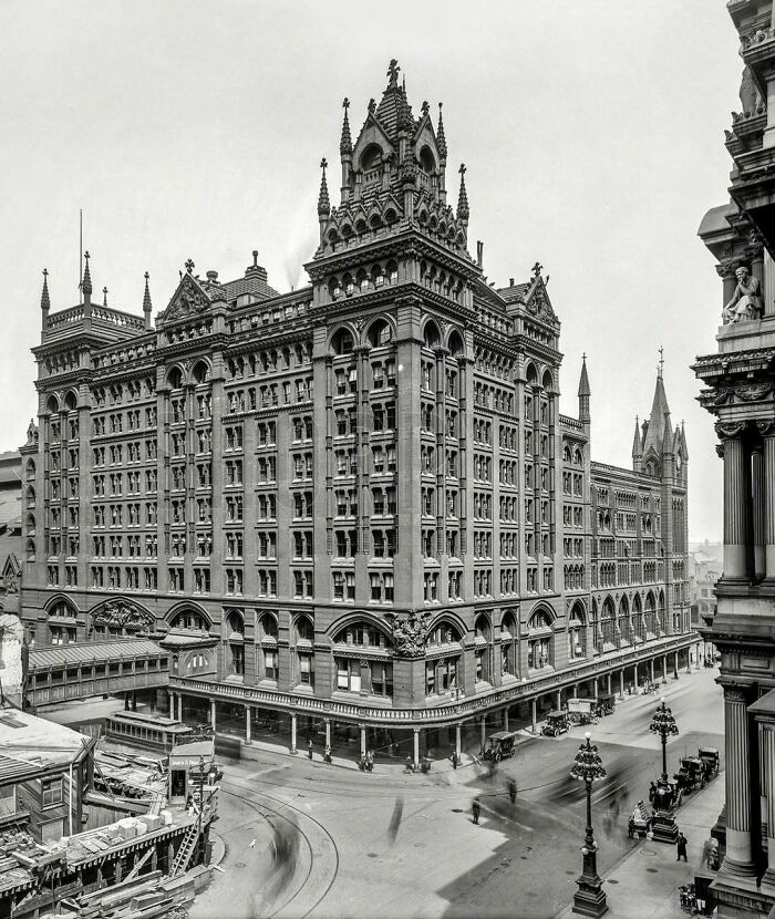 Historic American architecture showcased in a vintage black-and-white photo of an ornate multi-story building.