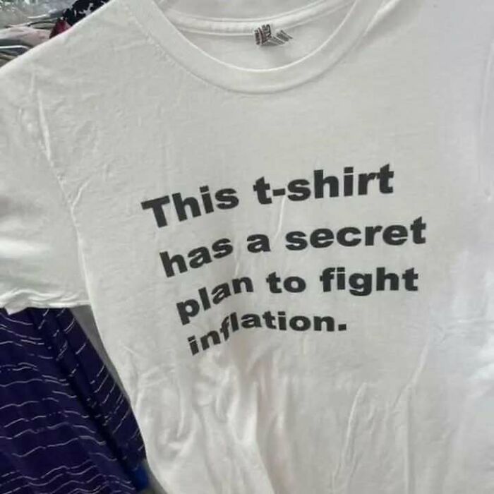 White t-shirt with humorous text about fighting inflation, showcasing chaotic t-shirts trend.