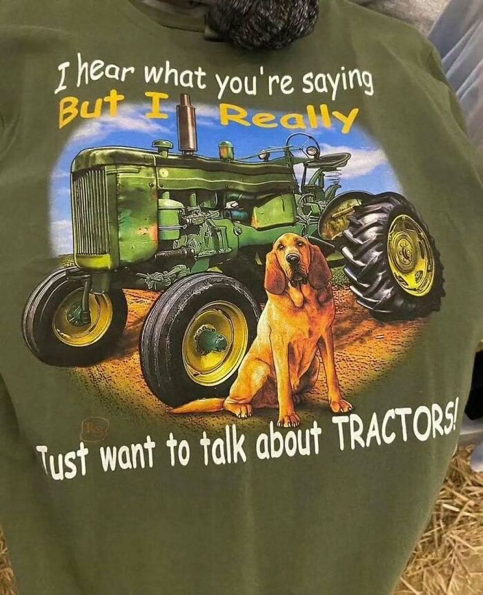 Green chaotic T-shirt with a tractor and dog design, humorously stating a love for tractors.