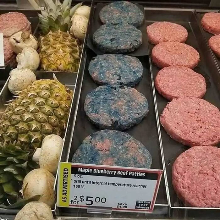 Blueberry beef patties displayed alongside pineapples and mushrooms, showcasing chaotic food combinations.