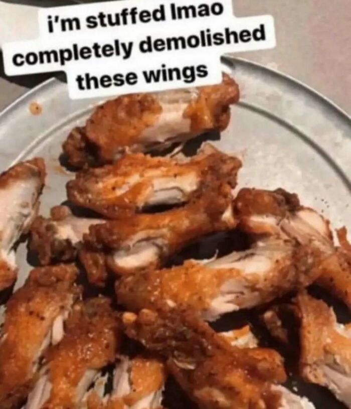 Plate of chicken wings with a funny caption, showcasing chaotic food humor.