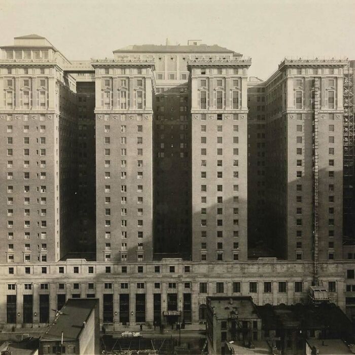 Historic American architecture with four towering structures and detailed facades in a sepia-toned image.