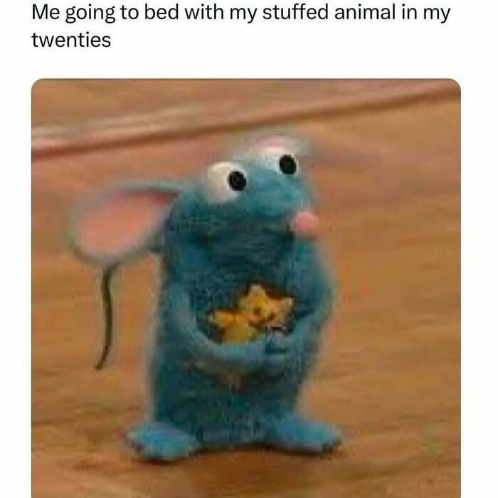 A blue cartoon mouse hugging a stuffed animal, conveying a heartwarming meme to brighten your day.