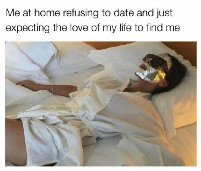 Woman humor meme showing person in bed with a face mask, captioned about waiting for love while refusing to date.