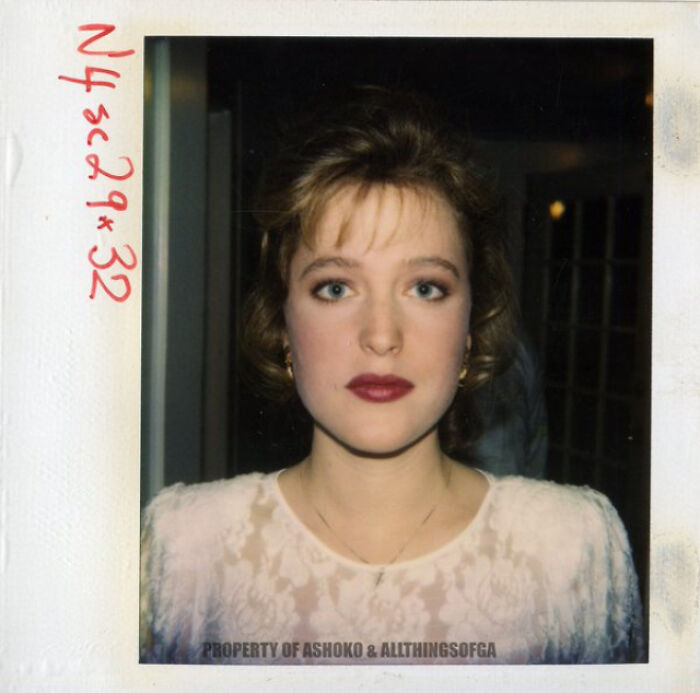 A woman in vintage attire posing for a historical photograph, offering a glimpse into the past.
