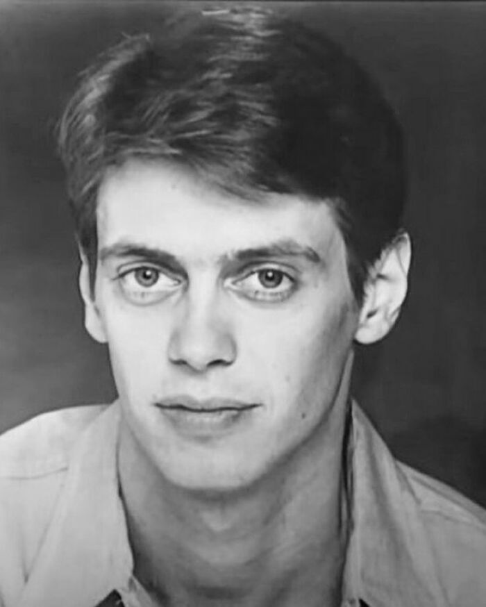 Young man in a black and white portrait, offering a fascinating look into the past.