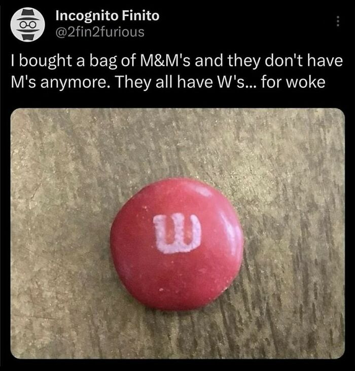 Red candy with a "W" instead of "M," referencing a humorous take on being "woke."