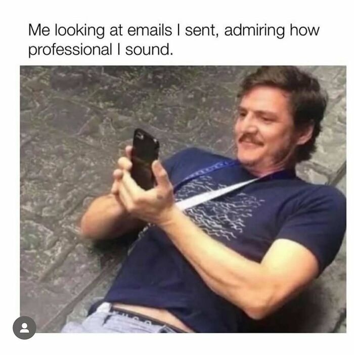 Man lying down, amused at his phone, representing memes to brighten your day.