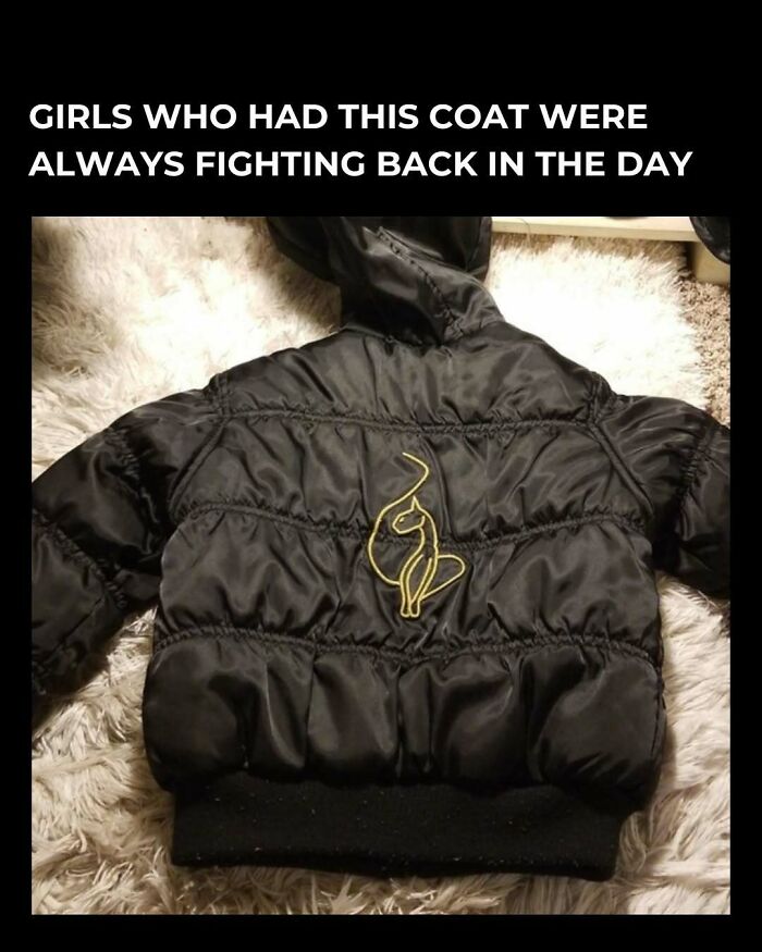 Black puffer coat with embroidered cat, nostalgic throwback for those who remember floppy disks.