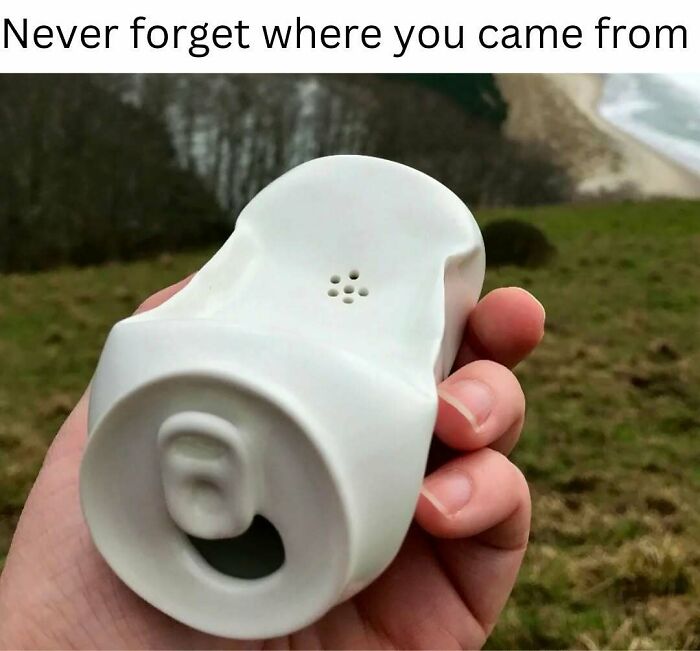 Person holding a ceramic piece resembling a crushed can with nostalgic humor.