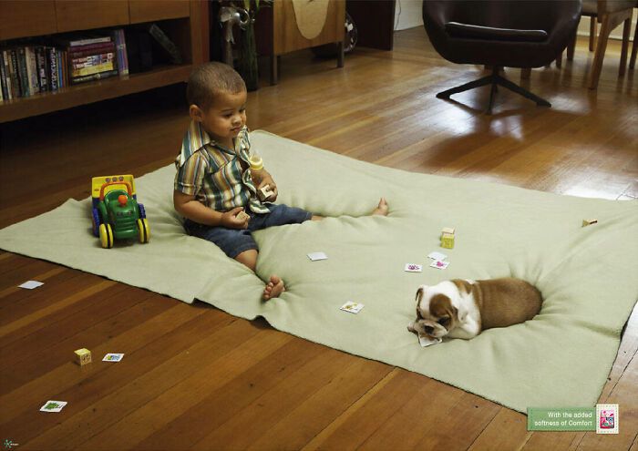 A toddler and puppy on a rug in a cozy room, capturing hearts with their adorable interaction.