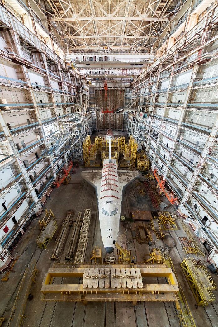 Abandoned shuttle in a decaying hangar, highlighting the beauty of forgotten places.