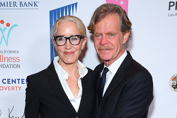 Felicity Huffman and William H. Macy smiling together at a red carpet event.