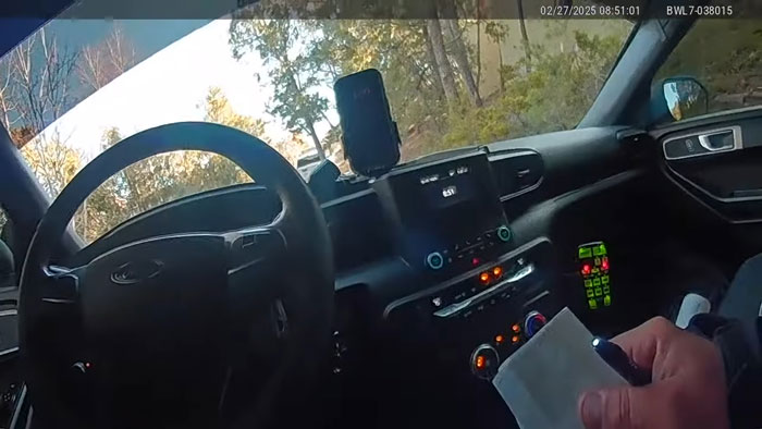 Officer's view from patrol car with notes, bodycam footage related to Gene Hackman’s daughter's emotional request. Officer's view from patrol car with notes, bodycam footage related to Gene Hackman’s daughter's emotional request.