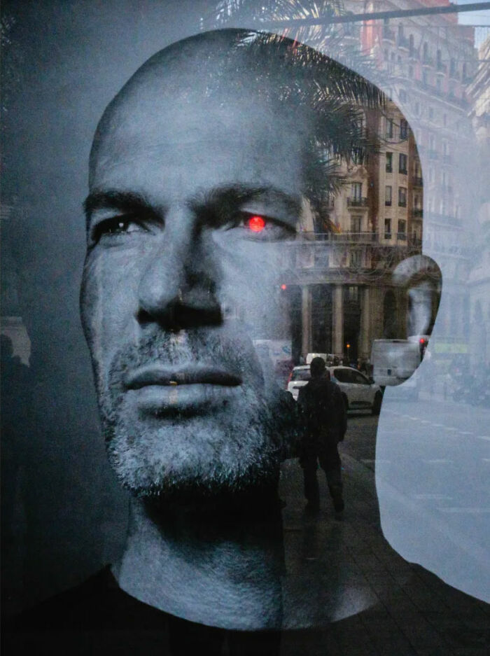 Reflection of a man's face with cityscape; Belgian photographer's take on the absurd human condition.