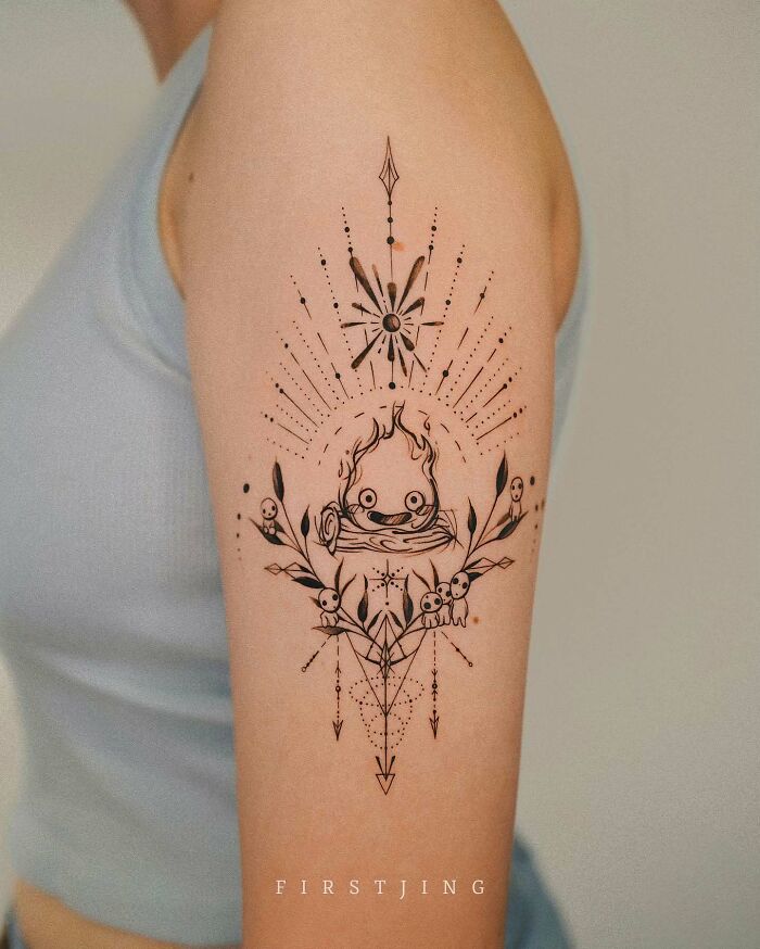 Fine-line tattoo with dreamy setting on arm, featuring intricate geometric and floral details.