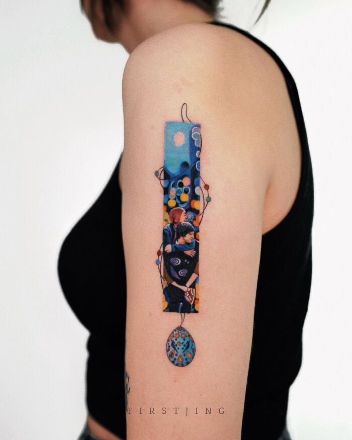 Fine-line tattoos showcasing colorful, dreamy settings on a person's arm.