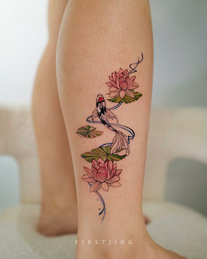 Fine-line tattoo of a koi fish and lotus flowers, showcasing dreamy settings on a person's leg.