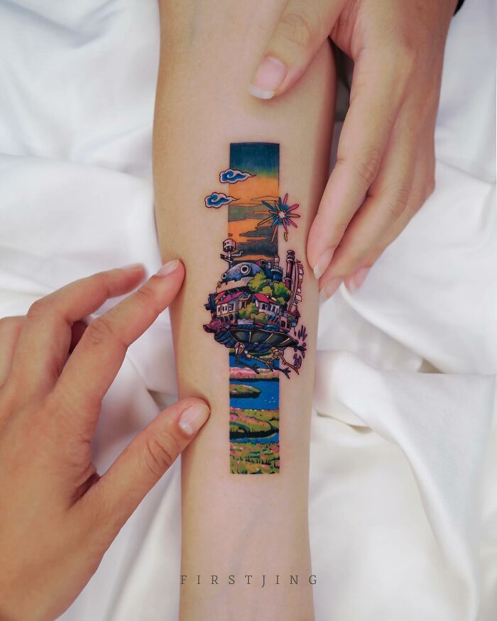 Fine-line tattoo with a dreamy setting on a forearm, featuring vibrant colors and intricate details.