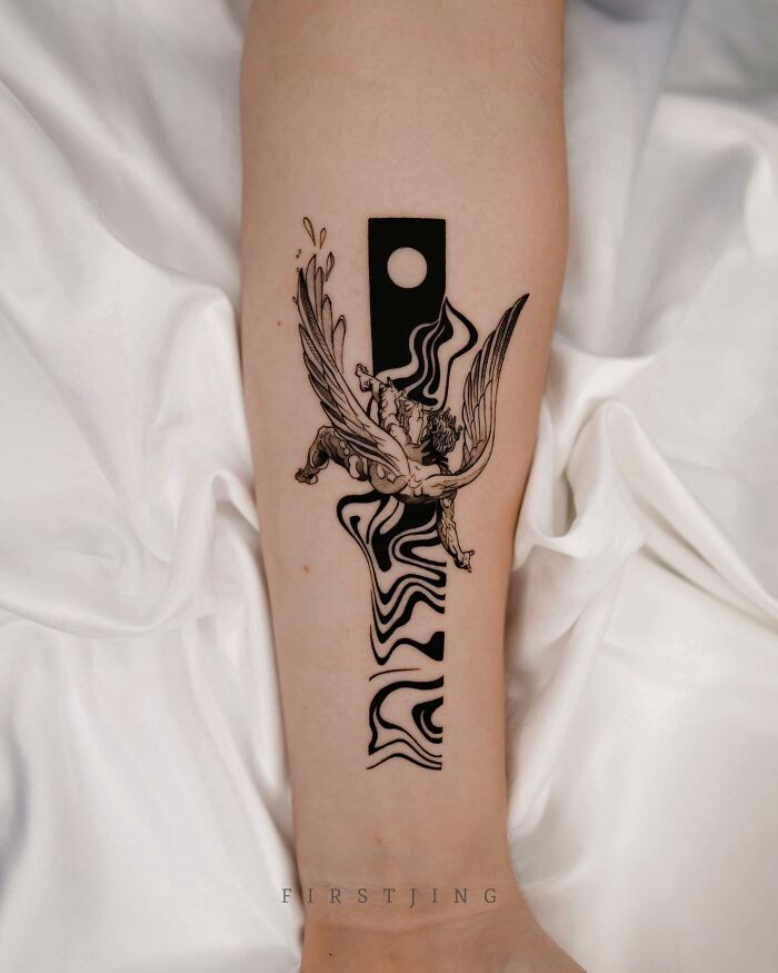Fine-line tattoo with dreamy winged horse design on arm, showcasing intricate artistry.