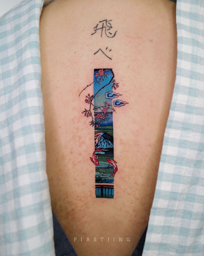 Fine-line tattoo with a dreamy landscape design on a person's back, featuring cherry blossoms and koi fish.