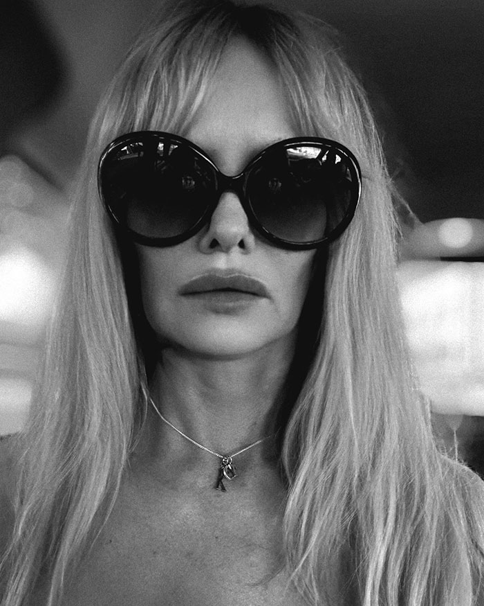 Woman with long hair and sunglasses, monochrome portrait, related to toxic relationship topic. Woman with long hair and sunglasses, monochrome portrait, related to toxic relationship topic.