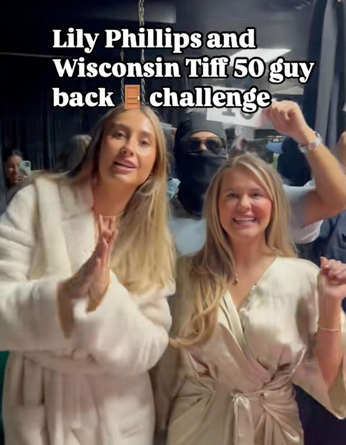 Lily Phillips and others in robes during the 50-men stunt challenge event.