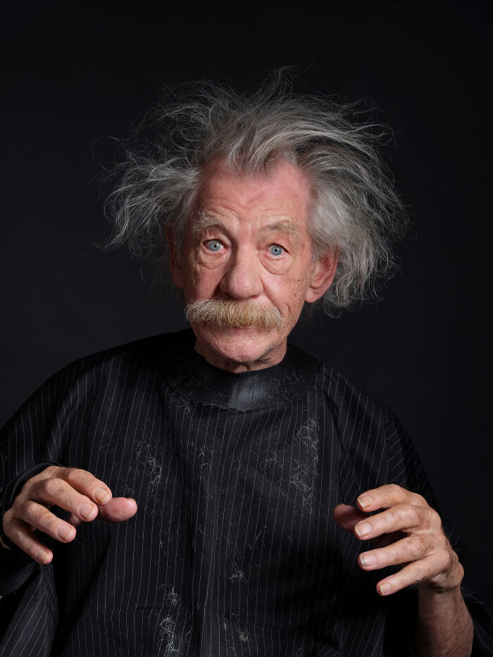 Elderly man with wild hair and mustache in a dark studio, representing a finalist from the 2024 IPA photo competition.