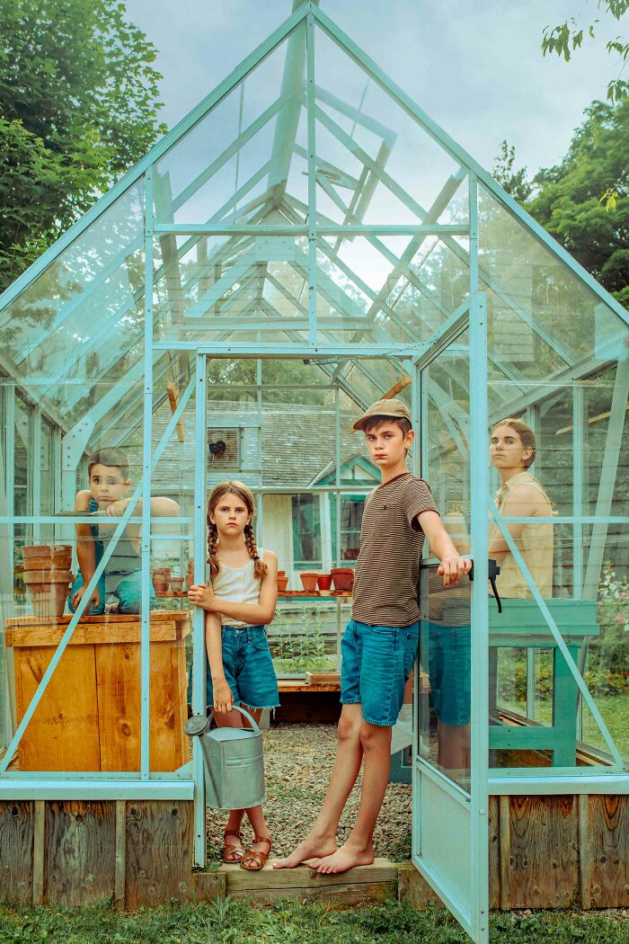 Children in a greenhouse, showcasing stunning photography by 2024 IPA winners and finalists.