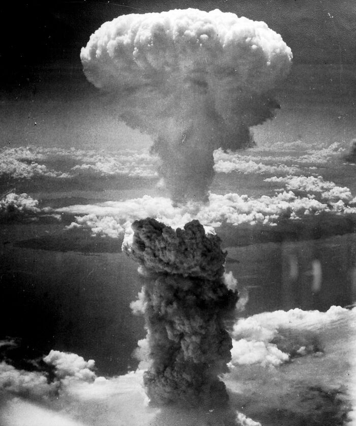 Mushroom cloud rising, symbolizing a major historical event, akin to future predictions coming true.
