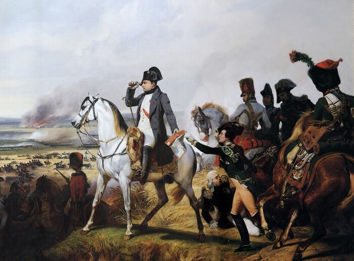 Napoleon on horseback surveying a battlefield, embodying historical misconceptions accepted as truth.