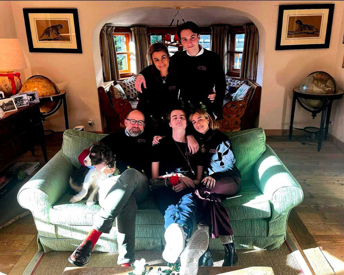 Family gathering on a green sofa in a warmly lit living room, with Prince Frederik's memory cherished. Family gathering on a green sofa in a warmly lit living room, with Prince Frederik's memory cherished.