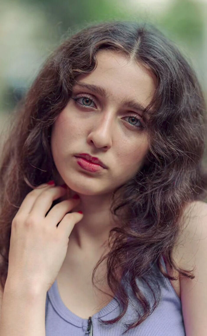 Portrait of a stranger by Indian photographer, capturing natural beauty with expressive eyes in soft lighting.