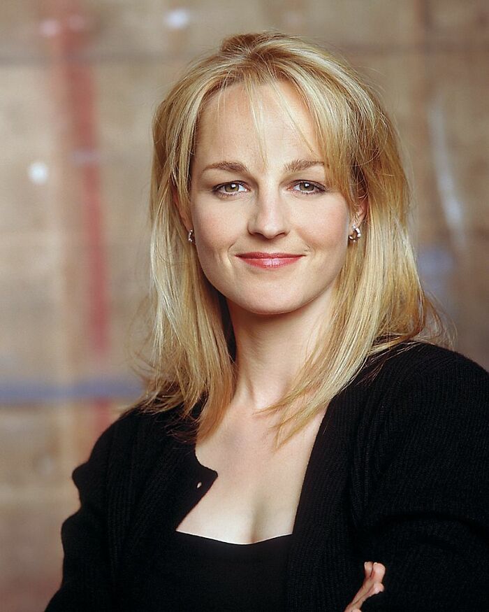 Portrait of a woman with blonde hair and a black top, in a casual setting. Portrait of a woman with blonde hair and a black top, in a casual setting.