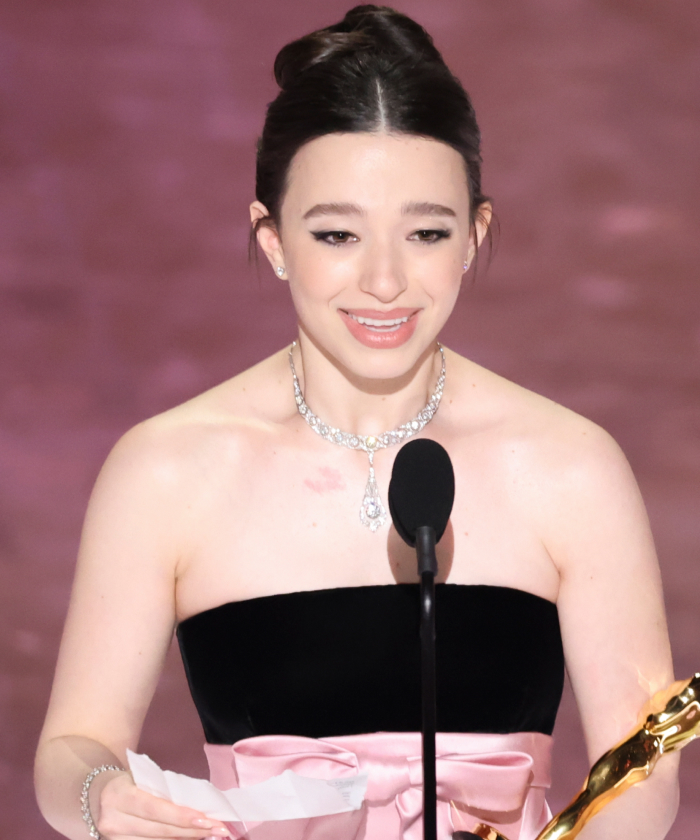 Mikey Madison holding Oscar trophy, sparking Best Actress outrage. Mikey Madison holding Oscar trophy, sparking Best Actress outrage.