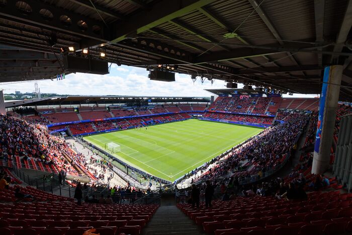 Panoramic view of a soccer stadium filled with fans during a match at one of the iconic cathedrals of soccer.