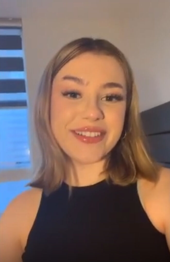 Smiling woman in a black top, related to selling virginity story. Smiling woman in a black top, related to selling virginity story.