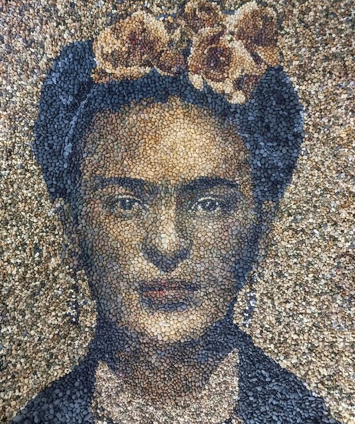 Intricate mosaic portrait made with stones and pebbles by British artist, showcasing detailed craftsmanship.